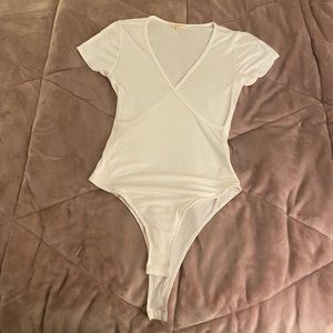 White cross body suit